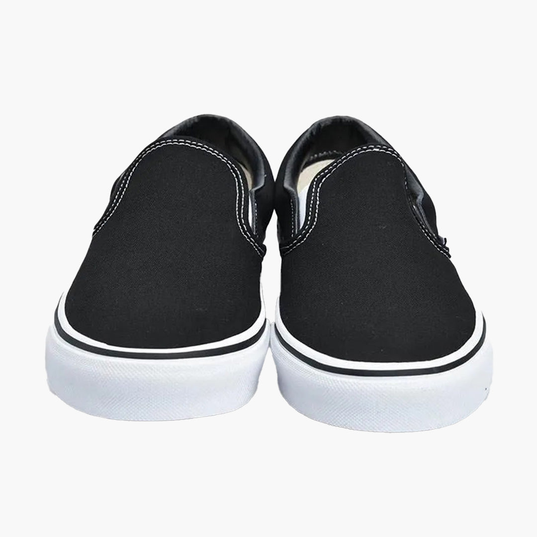 Vans classic slip hotsell on black monochromatic shoes